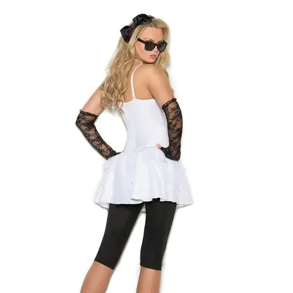 Woman wearing 80’s Madonna Costume.  Rock star costume showing layered skirt and hair bow (back view)