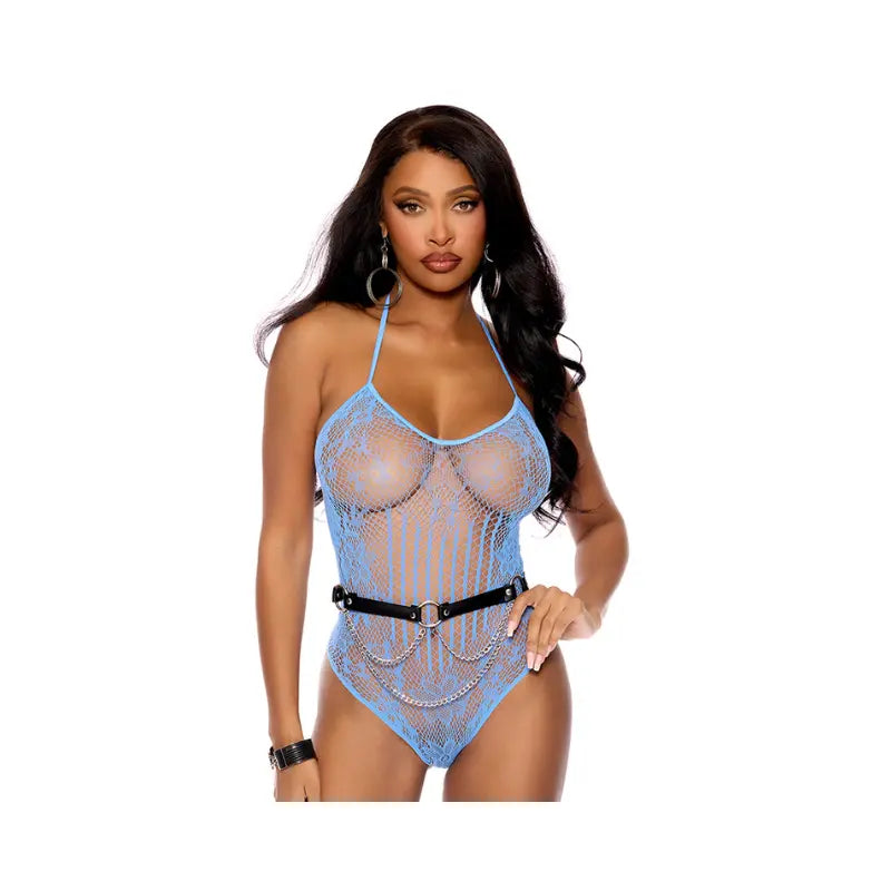 Close up front view of a woman wearing a light blue floral crochet teddy with a halter neck