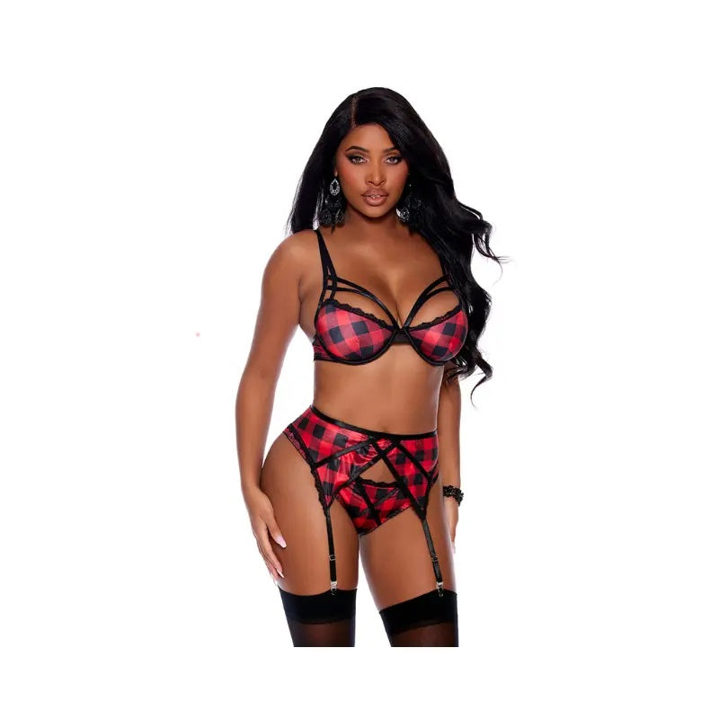 Model wearing a red and black checkered lingerie set on a white background